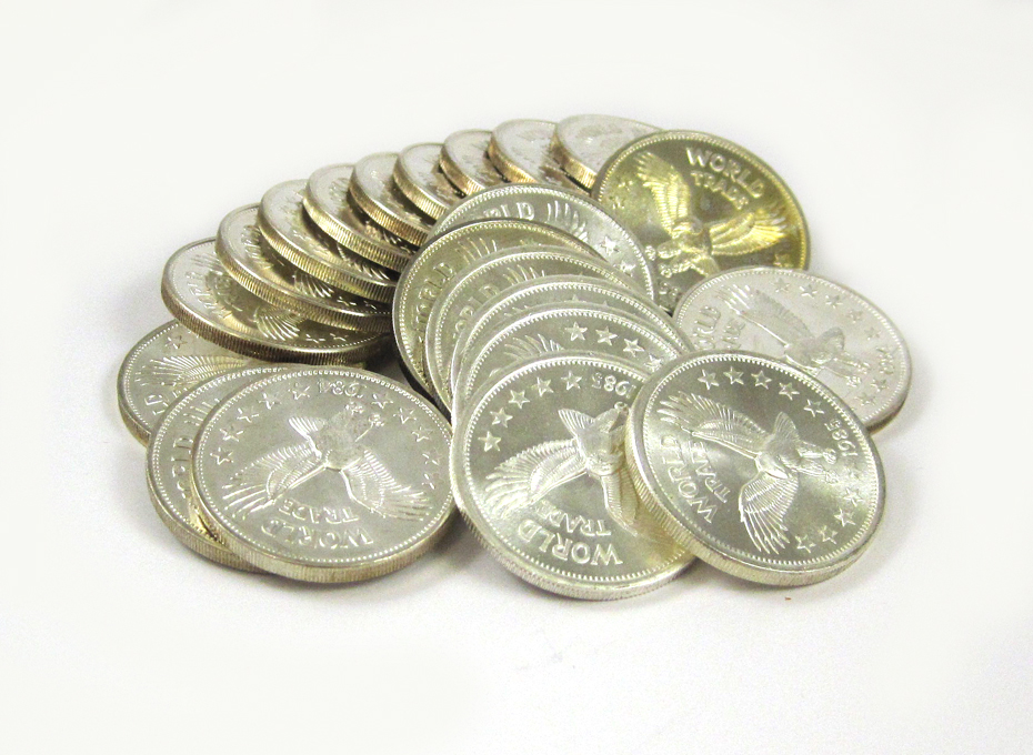 Appraisal: TWENTY-ONE SILVER WORLD TRADE COINS and each a one troy