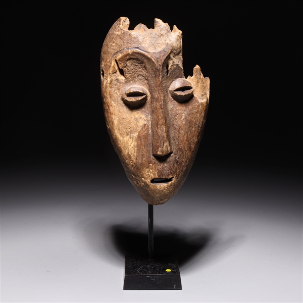 Appraisal: Carved wood central African tribal mask with custom metal stand