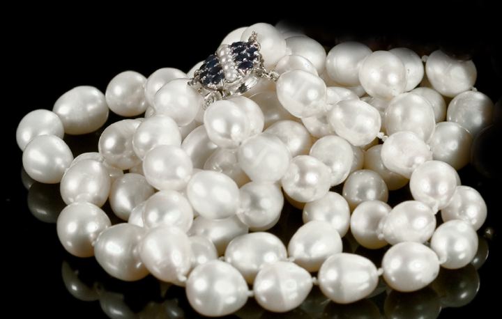 Appraisal: Graduated Double-Strand of Semi-Baroque Pearls mm to mm terminating with