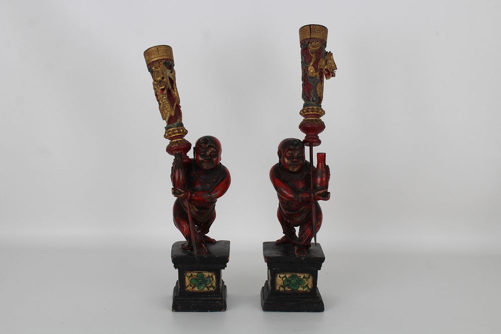 Appraisal: Chinese Wooden Figural Candle Holders Chinese Wooden Figural Candle Holders