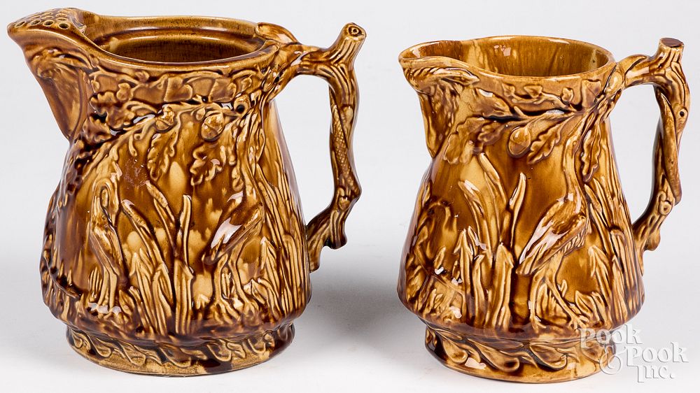 Appraisal: Two Bennington type pitchers th c Two Bennington type pitchers