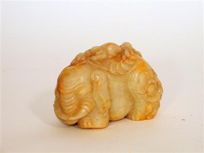 Appraisal: Chinese white russet jade elephant and boy model th century