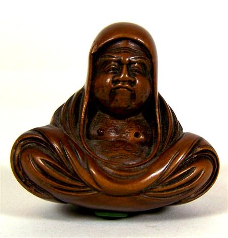 Appraisal: A Japanese carved wood netsuke Meiji period in the form