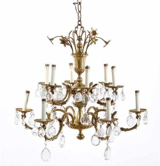 Appraisal: Continental bronze and crystal twelve-light chandelier floral canopy above acanthus