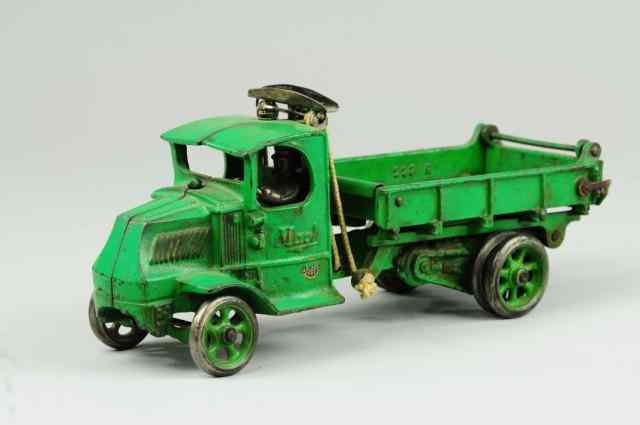 Appraisal: MACK T-BAR DUMP TRUCK Arcade cast iron example of enclosed