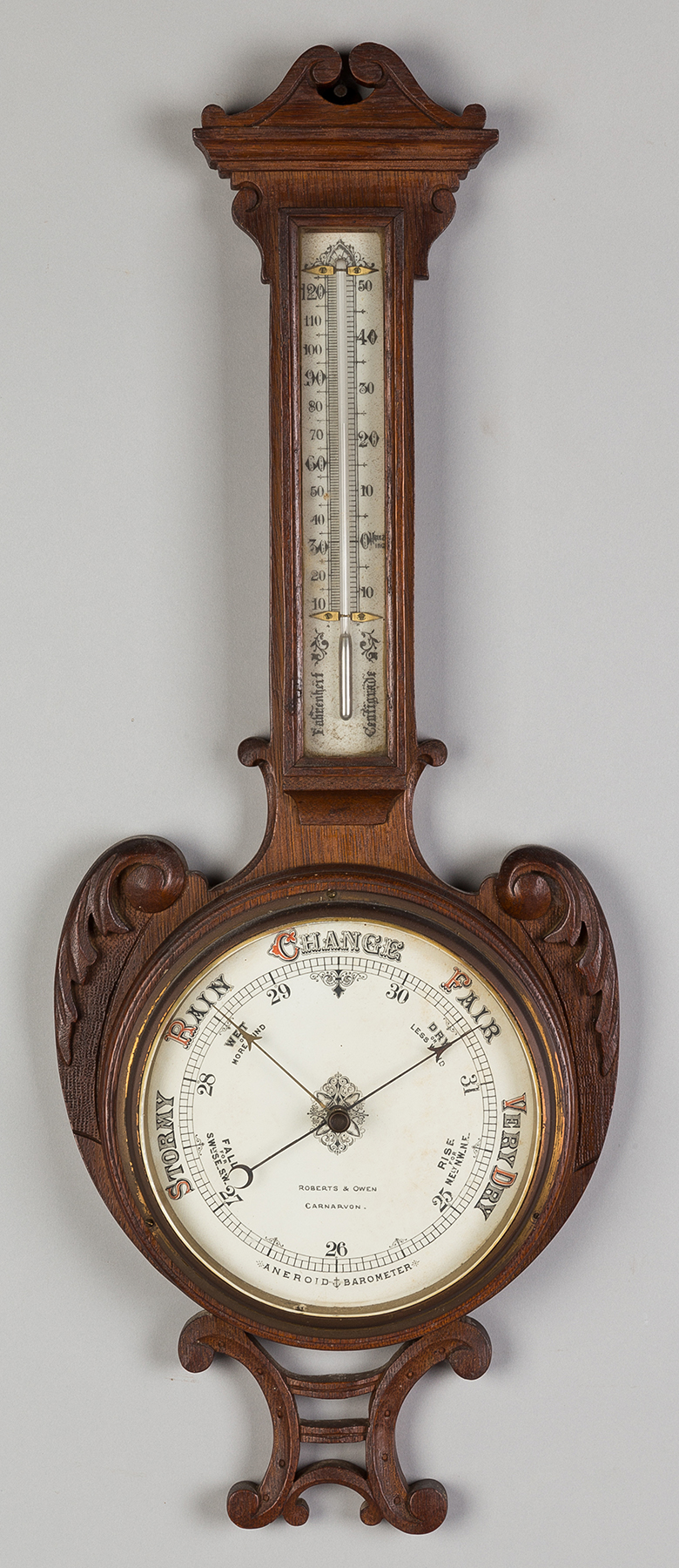 Appraisal: Roberts and Owen Barometer and Thermometer Carved oak case in