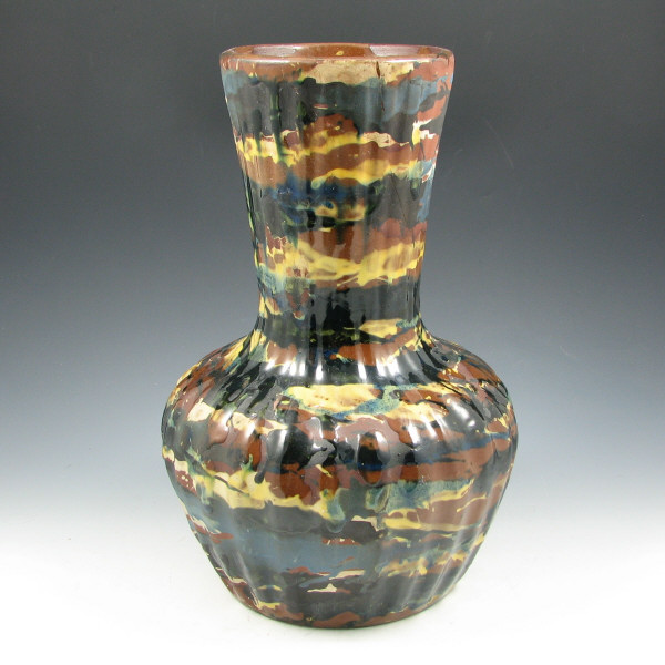 Appraisal: Peters Reed Marbelized vase with vertical ribs in dark Earth