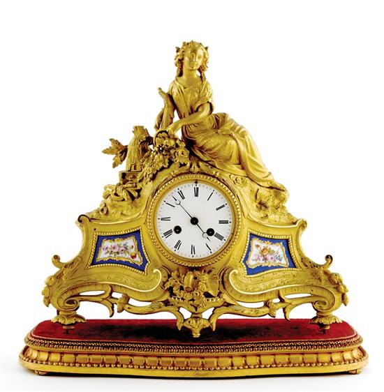 Appraisal: French gilt-metal mantel clock circa arched shaped gilded case topped