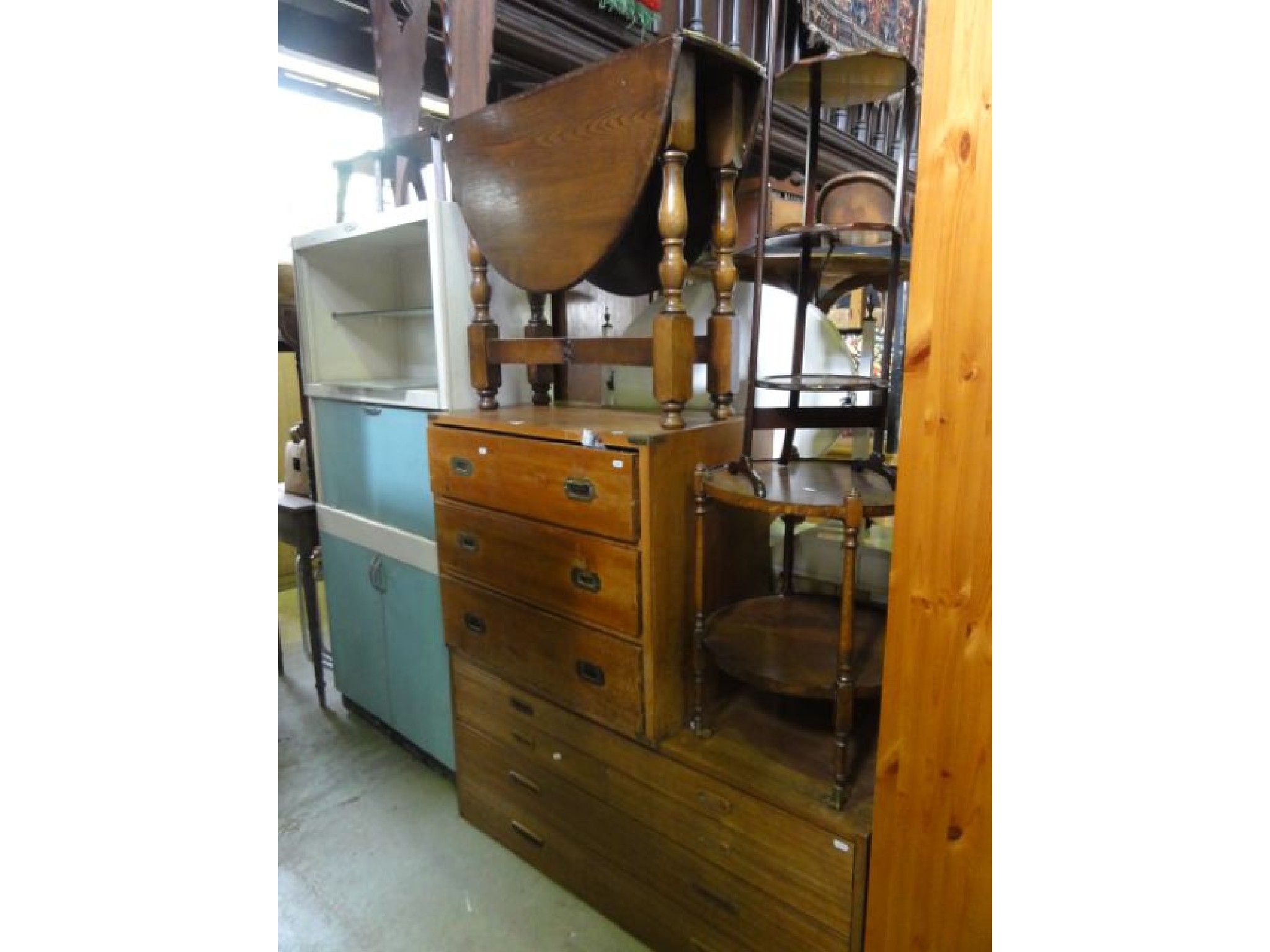 Appraisal: A small reproduction yew wood veneered chest of three long