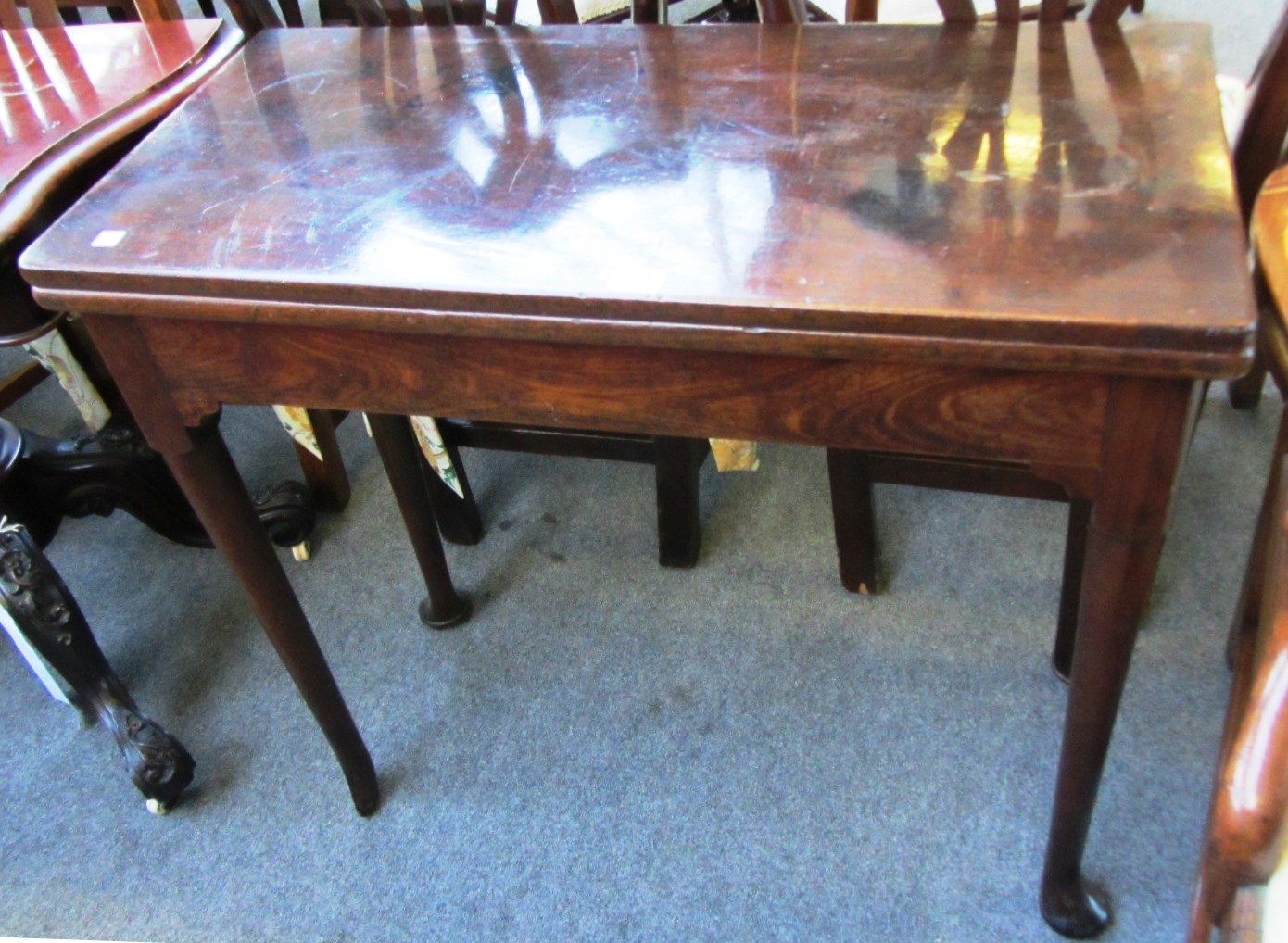 Appraisal: A th century rectangular mahogany card table on club supports