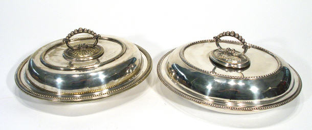 Appraisal: Pair of silver plated oval tureens with beaded decoration and