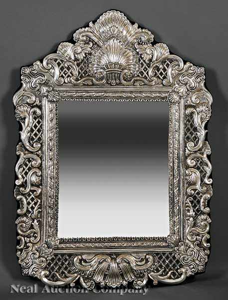 Appraisal: A Decorative Sterling Silver Repouss Mirror in the Baroque taste