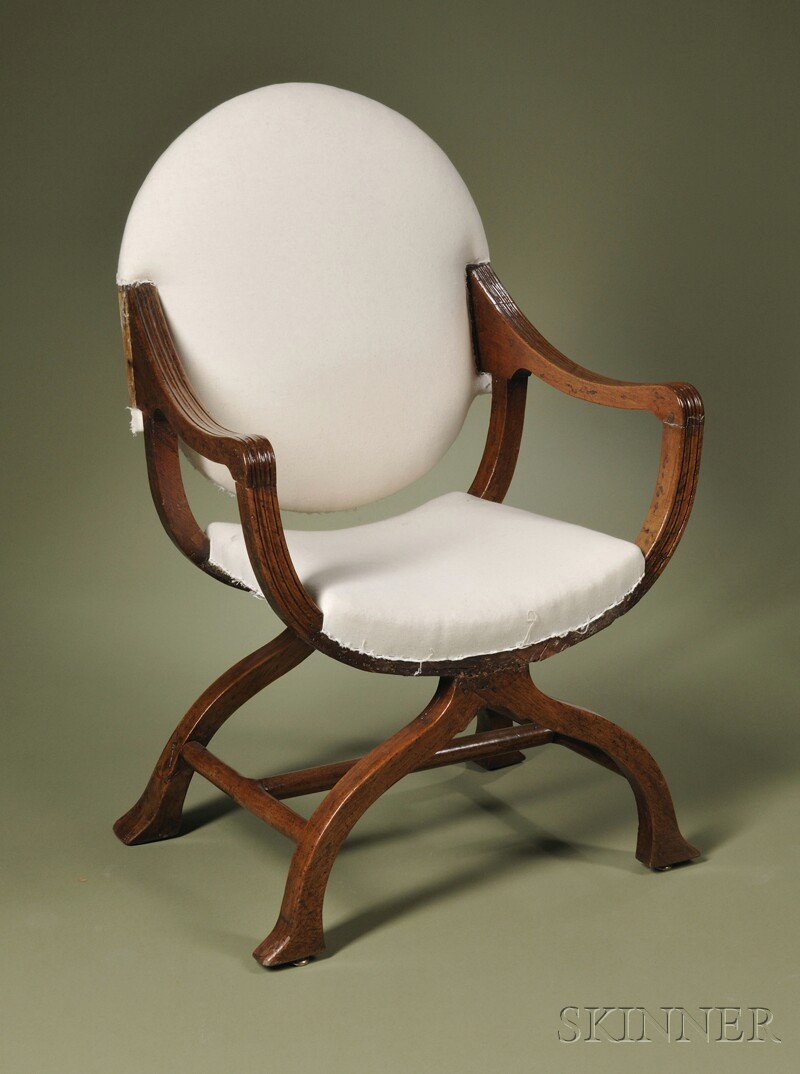 Appraisal: Italian Curule Armchair upholstered circular back with reeded armrests on