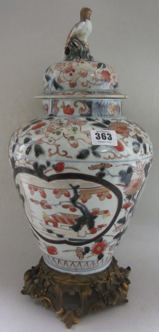 Appraisal: A Japanese Imari ovoid vase and cover circa one side