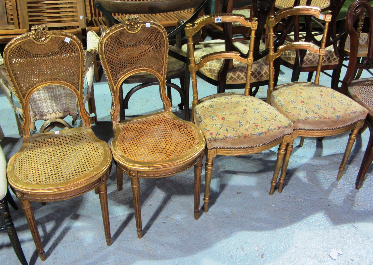 Appraisal: A set of four th century gilt painted side chairs