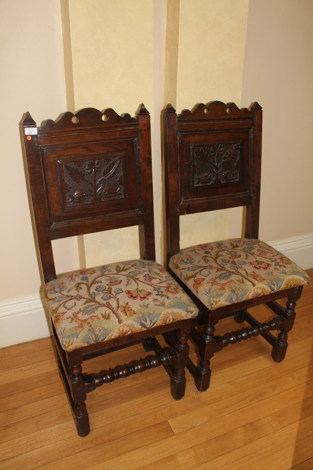 Appraisal: A pair of thC oak side chairs with carved panel