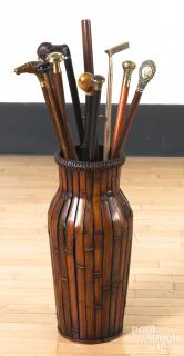 Appraisal: Collection of canes together with a rattan stand