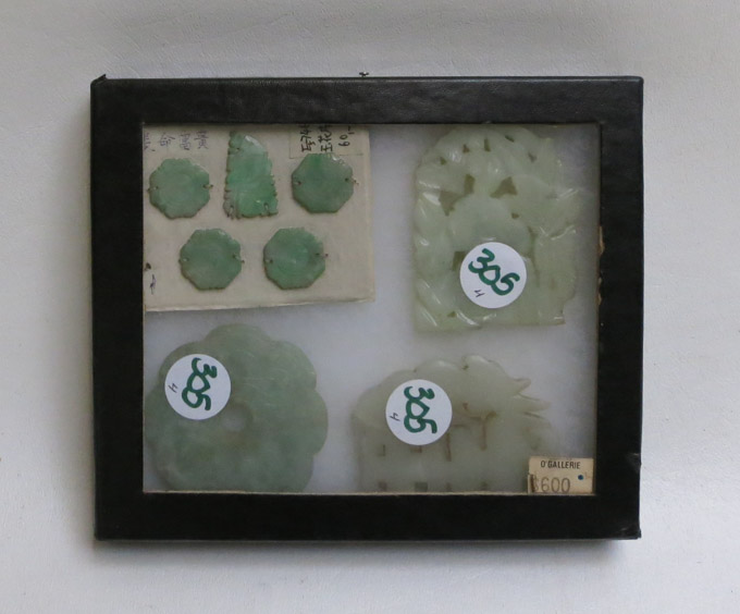 Appraisal: CHINESE JADE AND HARDSTONE MEDALLIONS AND BUTTONS the paper card