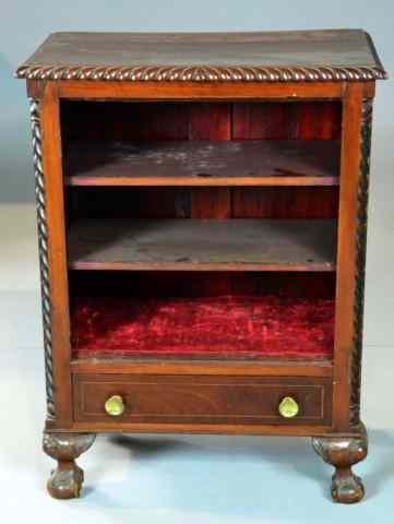 Appraisal: An American Carved Walnut And Inlaid CabinetRectangular overhanged barley twist