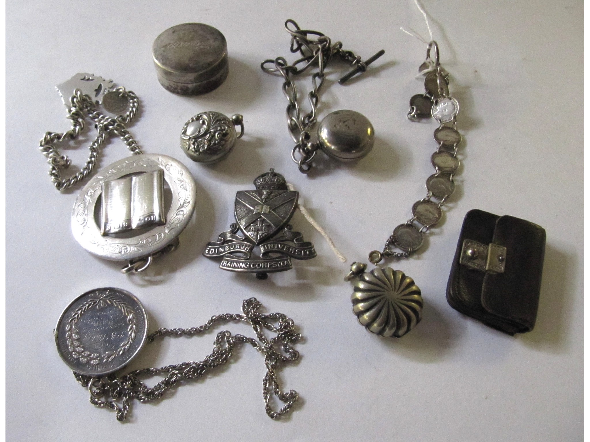 Appraisal: A box of miscellaneous white metal items - sovereign cases