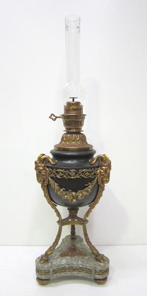 Appraisal: A DECORATIVE ORMOLU LAMP WITH TRI-FOOTED STAND ON MARBLE PLINTH