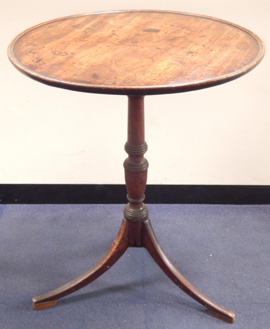 Appraisal: A thC mahogany circular tripod table with moulded border and