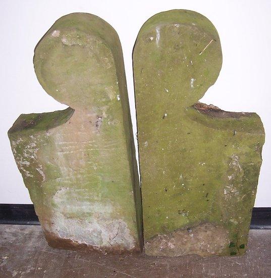 Appraisal: A pair of stone seat ends with silhouette poppy finials