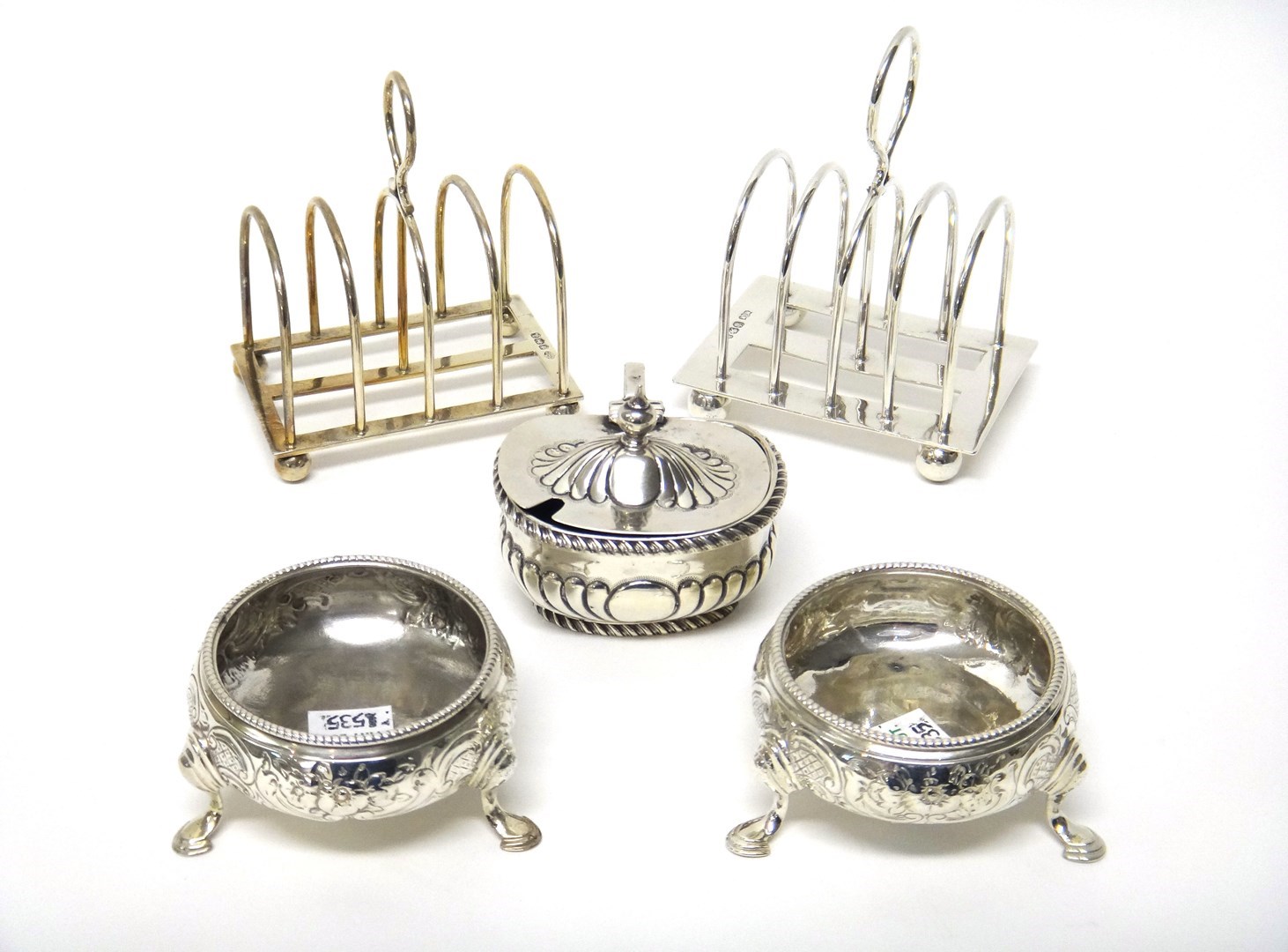 Appraisal: Silver comprising a five bar toastrack raised on four spherical