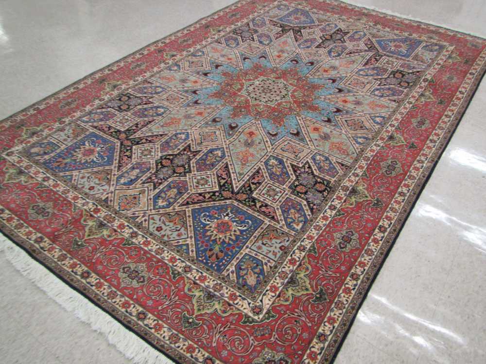 Appraisal: A CONTEMPORARY PERSIAN WOOL AND PART SILK CARPET hand knotted