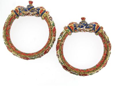 Appraisal: A pair of Indian gold hinged bangles with elephant terminals