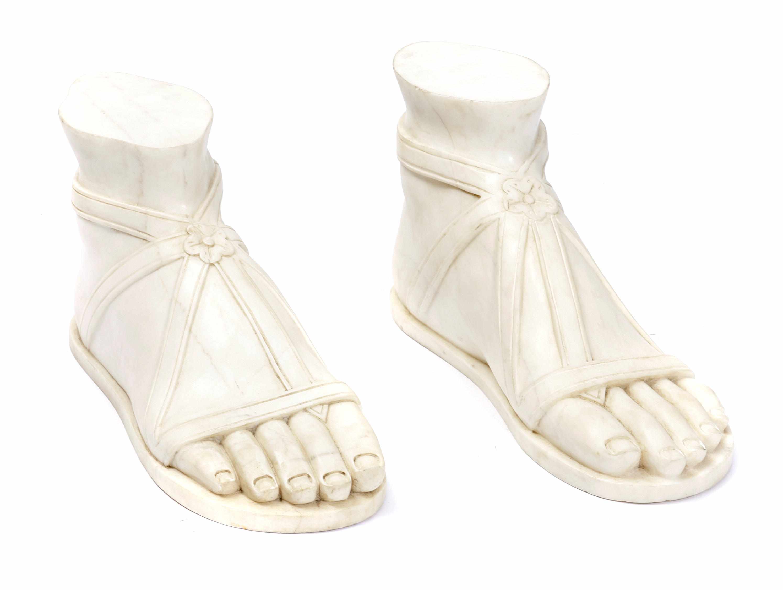 Appraisal: A pair of Classical style carved marble feet after the