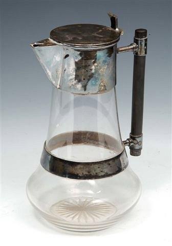 Appraisal: A CLARET JUG designed by Christopher Dresser with plated mounts