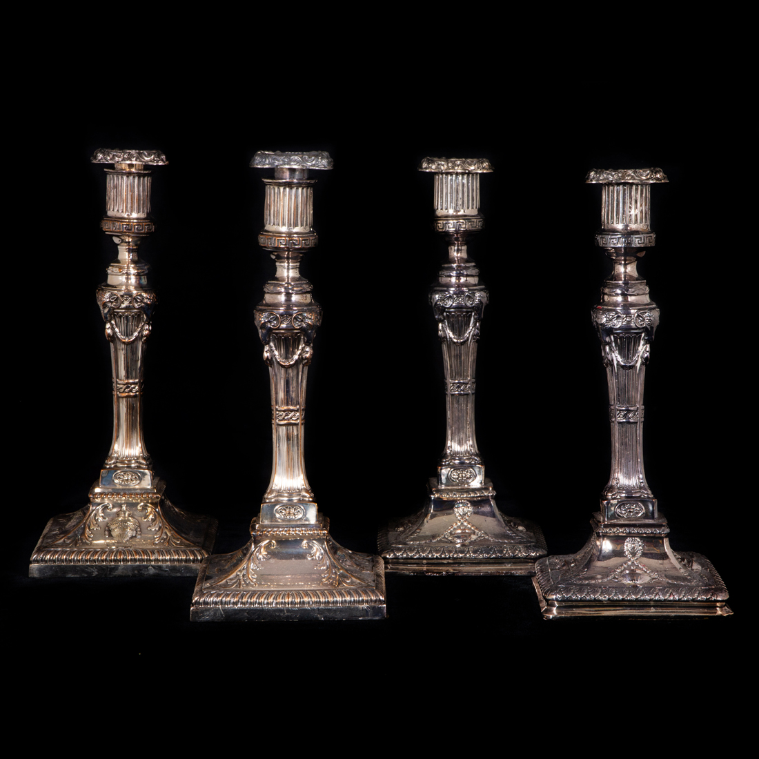 Appraisal: SET OF FOUR SHEFFIELD PLATE COLUMNAR CANDLESTICKS FASHIONED IN THE