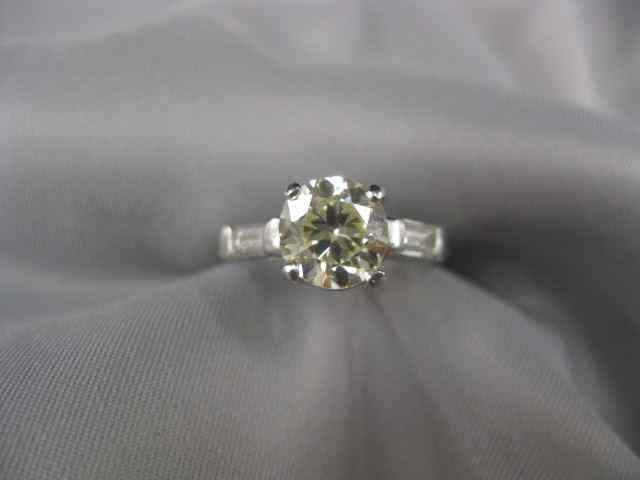 Appraisal: Platinum Diamond Ring carat round brilliant with baguette on each