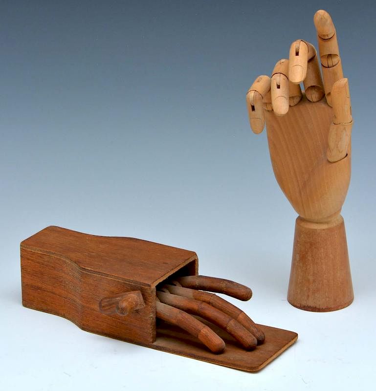 Appraisal: Grouping of two wood novelty model hands Grouping of two