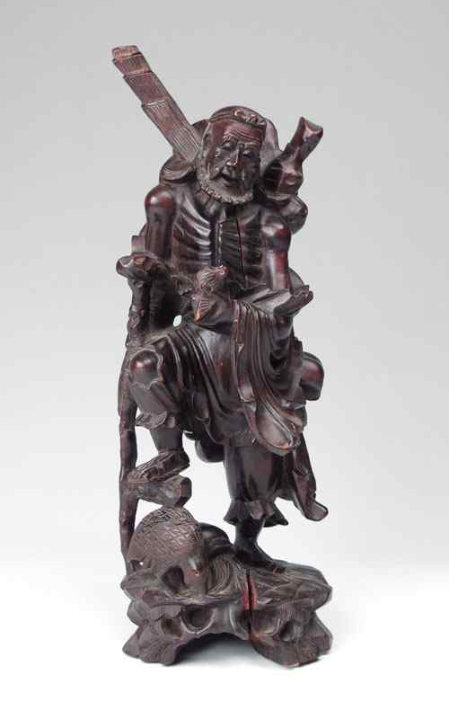 Appraisal: CHINESE CARVED WOOD TRAVELER Figural carved man holding a bird