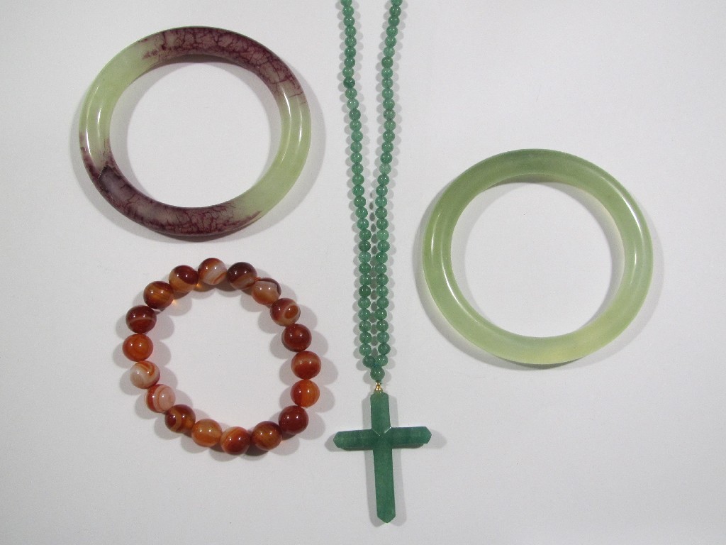 Appraisal: Lot comprising two jade bangles jade cross pendant necklace and