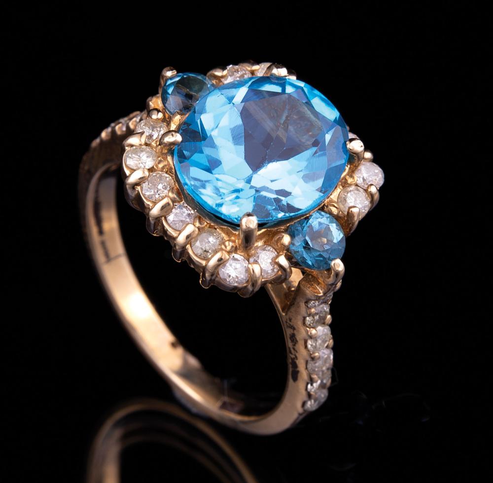 Appraisal: kt Gold Blue Topaz and Diamond Ring central round topaz