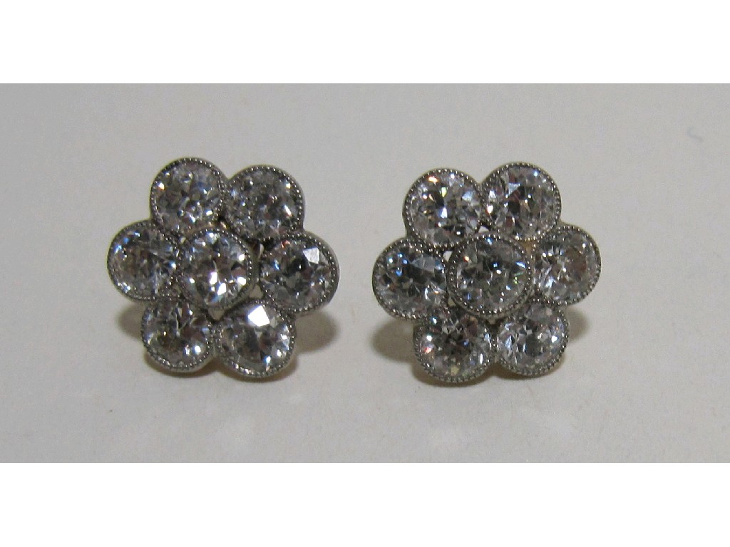 Appraisal: Nineteen thirties flower head diamond cluster stud earrings with seven