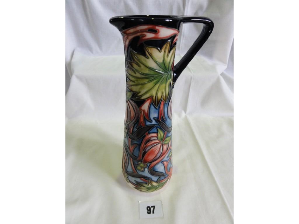 Appraisal: A Moorcroft Pottery ewer with moulded and painted purple and