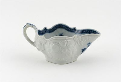 Appraisal: A Chinese porcelain blue and white sauceboat the exterior moulded