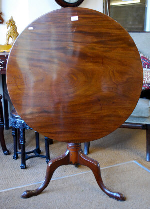 Appraisal: George III mahogany circular tilt top tripod table raised om