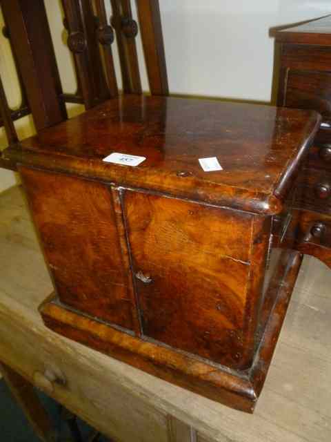 Appraisal: A VICTORIAN BURR WALNUT VENEERED STATIONERY CABINET enclosed by two