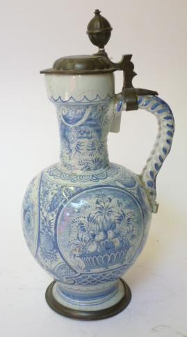 Appraisal: A CONTINENTAL FAIENCE EWER th century of globular form with