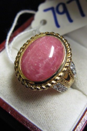 Appraisal: RHODOCHROSITE DIAMOND AND FOURTEEN KARAT GOLD RING centering an oval