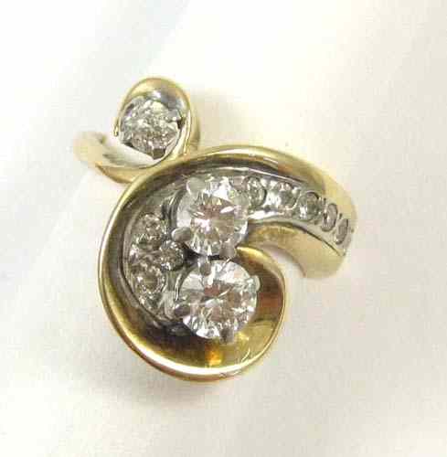 Appraisal: DIAMOND AND FOURTEEN KARAT GOLD RING set with twelve round-cut