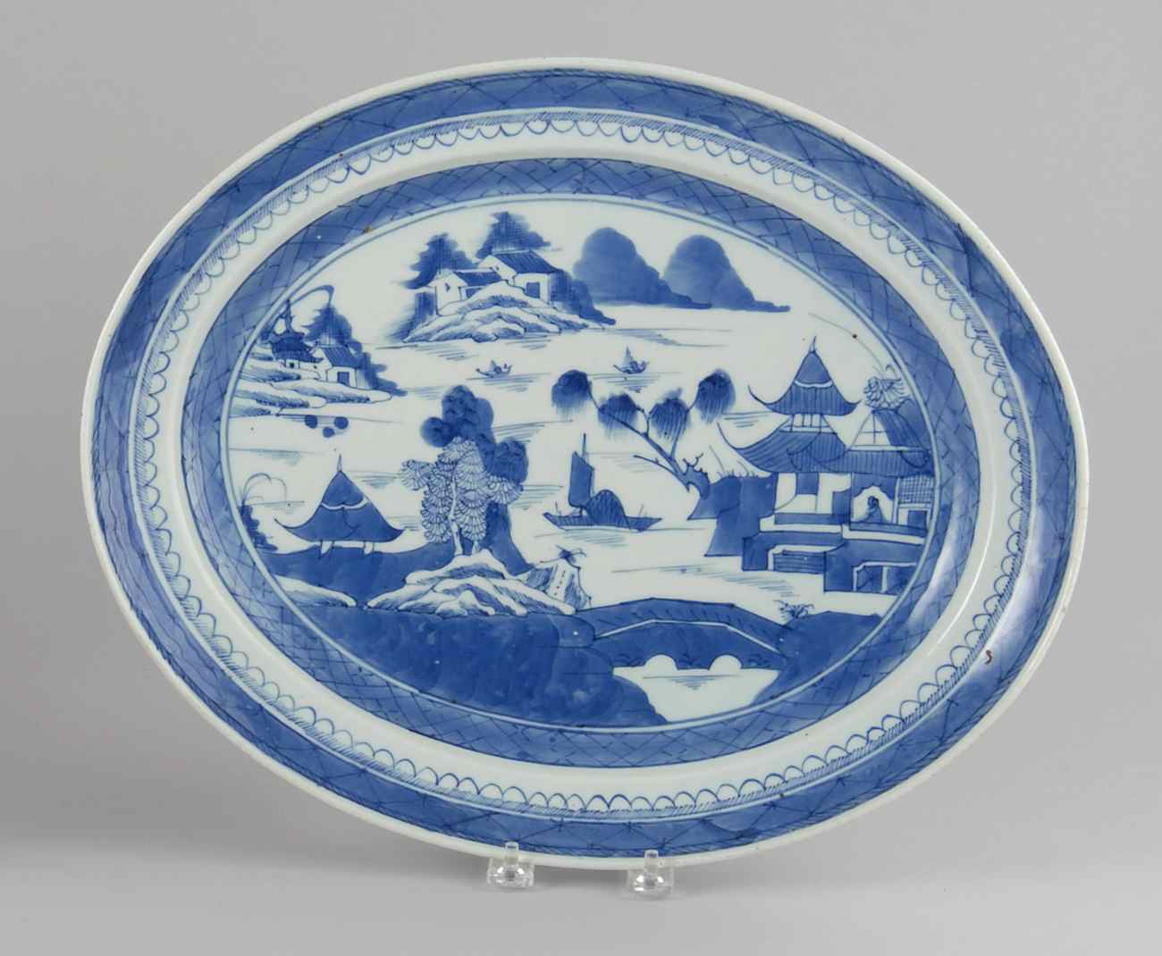 Appraisal: CHINESE EXPORT BLUE AND WHITE PORCELAIN PLATTER In oval form