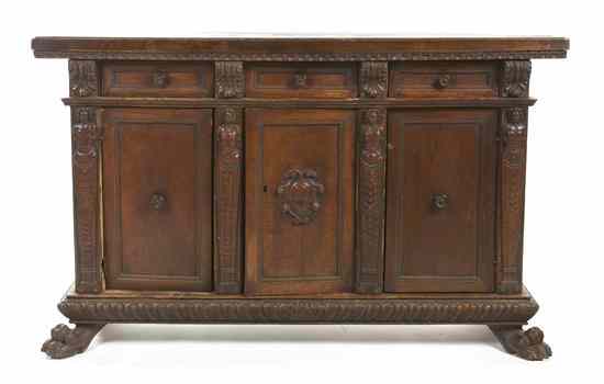 Appraisal: A Renaissance Revival Carved Walnut Console Cabinet having a rectangular