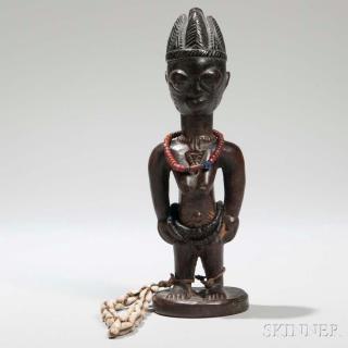 Appraisal: Yoruba Ibeji Doll the female figure wearing strands of trade