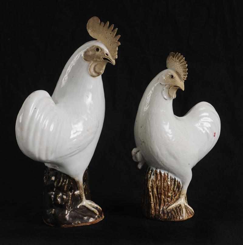 Appraisal: CHINESE WHITE-GLAZED BISCUIT PORCELAIN FIGURES OF A ROOSTER AND A